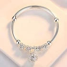 Elegant Silver-Tone Bangle Bracelet with Floral Engraved Design & Round Dangle Charm – Stylish Fashion Jewelry for Women