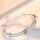 Elegant Silver-Tone Bangle Bracelet with Floral Engraved Design & Round Dangle Charm – Stylish Fashion Jewelry for Women