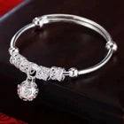 Elegant Silver-Tone Bangle Bracelet with Floral Engraved Design & Round Dangle Charm – Stylish Fashion Jewelry for Women